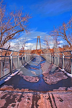 Symmetrical Bridge Walkway Under A Bright Blue Sky