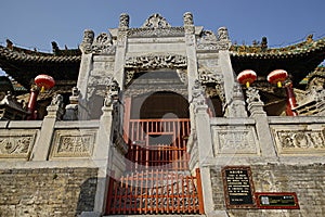 Symmetrical chinese ancient stone decorated archway in Henan, China.