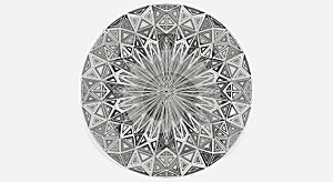A symmetrical, circular geometric pattern composed of intricate black and white