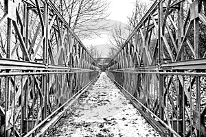 Symmetrical metal footbridge, image cut into halves and quarters