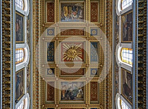 symmetrically framed ceiling of the interior of the Basilica sacro cuore, Rome, Italy.