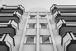 Symmetry of balconies and windows against the blue sky