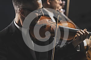 Symphonic string orchestra performing on stage