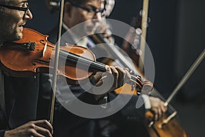 Symphonic string orchestra performing on stage