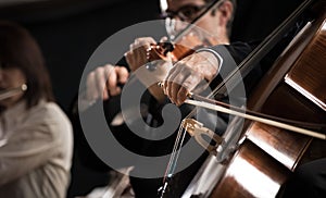 Symphony orchestra: cello player close-up