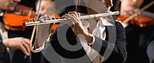 Symphony orchestra performance: flutist close-up