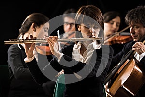 Symphony orchestra performance: flutist close-up