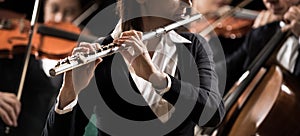 Symphony orchestra performance: flutist close-up