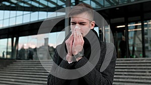 Symptomatic Strain Young Adult Sneezes and Coughs Due to Seasonal Flu Outdoors