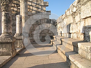 Synagogue in Capernaum. Benches for sitting photo