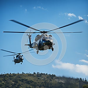 Synchronized flight two choppers command the vibrant blue airways