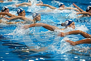 Synchronized swimmers hands in perfect alignment, exemplifying coordination in olympic sport photo