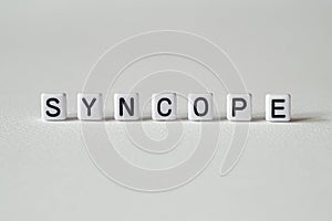 Syncope - word concept on cubes photo