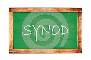 SYNOD text written on green school board