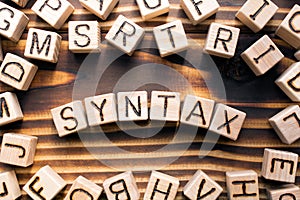 syntax composed of wooden cubes with letters