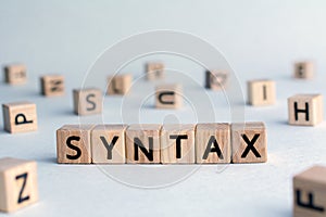 syntax - word from wooden blocks with letters