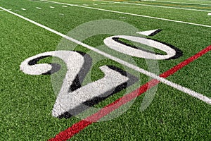 Synthetic turf slanted football 20 yard line in white