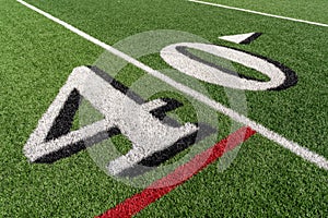 Synthetic turf slanted football 40 yard line in white