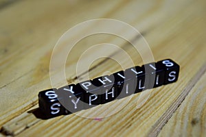 Syphilis written on wooden blocks. Inspiration and motivation concepts.