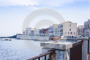 Syracuse, Sicily, Italy - ancient street with old buildings in the seafront of Ortygia Ortigia Island