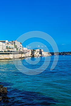Syracuse, Sicily, Italy Ã¢â¬â August 23, 2018 : Panoramic view of the Ortigia waterfront in Syracuse with the blue sky background