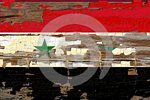 Syrian flag on old wood.