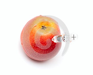 Syringe in apple