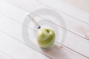 Syringe apple isolated on white background