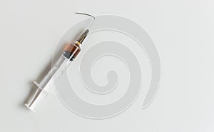 Syringe with a bent needle.