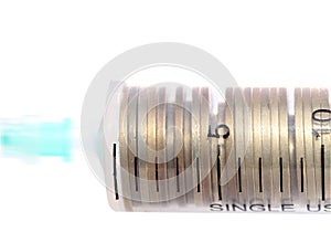 Syringe with coins concept financial investments