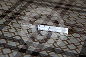 Syringe with flush attachment