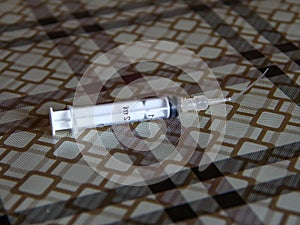Syringe with flush attachment