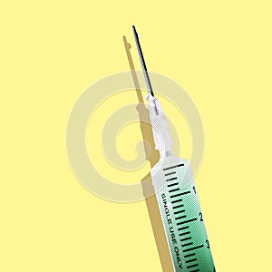 Syringe with a green solution on a yellow background