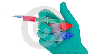 Syringe in hand medical glove medicine