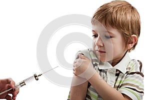 Syringe injecting child photo