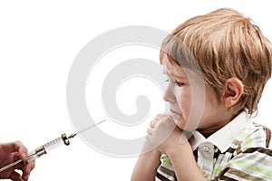 Syringe injecting child photo