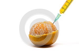 Syringe injection into fresh orange with half peel on white background