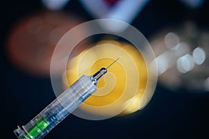 Syringe and medal set in background. Doping and drugs in sport, concept photo. Black background