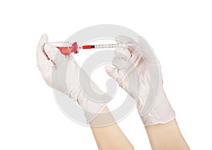 Syringe and medical ampoule in hands