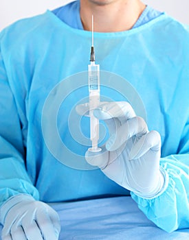 Syringe, medical injection in hand, palm or fingers. Medicine plastic vaccination equipment with needle. Nurse doctor