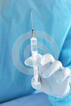 Syringe, medical injection in hand, palm or fingers. Medicine plastic vaccination equipment with needle. Nurse doctor