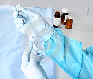 Syringe, medical injection in hand, palm or fingers. Medicine plastic vaccination equipment with needle. Nurse doctor