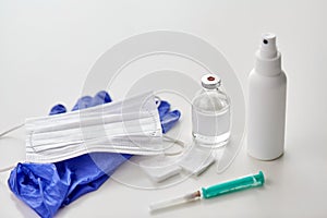 Syringe, medicine, wound wipes, gloves and mask