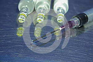 Syringe, needle and droplet