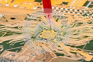 Syringe with needle filled with virus vaccine vaccination circuit board.