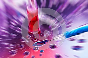 Syringe needle with fluid drops