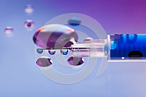 Syringe needle with fluid drops