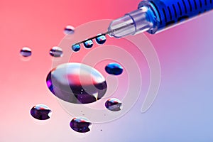 Syringe needle with fluid drops