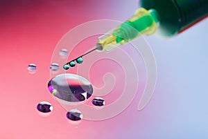 Syringe needle with fluid drops