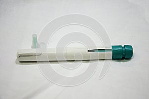 Syringe and needle inject Gonadotropins medicine at stomach photo